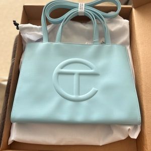 Fresh never worn or used telfar bag , baby blue color